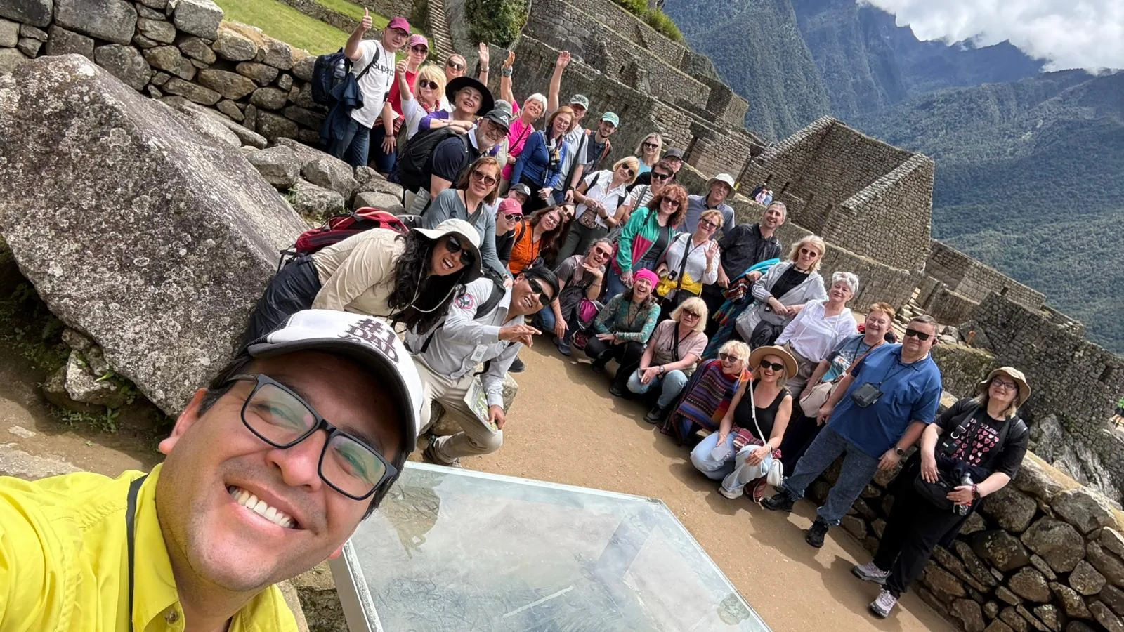 Joseph Guevara guiding travelers in Machu Picchu